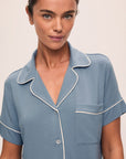 Model is wearing Gisele TENCEL™ Modal Relaxed Short PJ Set in Faded Denim/Ivory