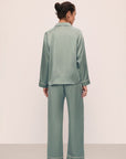 Model is wearing Inez Washable Silk Long PJ Set in Eucalyptus/Ivory