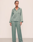 Model is wearing Inez Washable Silk Long PJ Set in Eucalyptus/Ivory