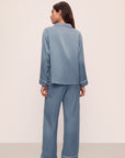 Model is wearing Inez Washable Silk Long PJ Set in Faded Denim/Ivory