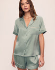 Model is wearing Inez Washable Silk Short PJ Set in Eucalyptus/Ivory