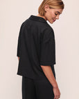 Model wears Tencel Woven Short Sleeve Top in Black