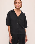 Model wears Tencel Woven Short Sleeve Top in Black