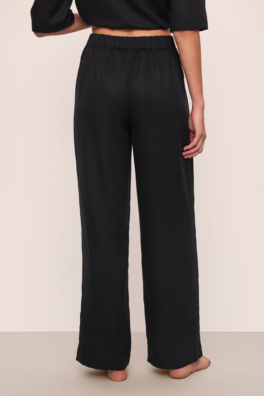 Model wears Tencel Woven Pant in Black