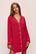 Model wears Gisele TENCEL™ Modal Sleepshirt in Haute Red/Ivory.