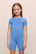 Model is wearing the Kids TENCEL™ Modal Unisex Short PJ Set in cornflower blue/white
