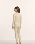 Model is wearing Kids TENCEL™ Modal Unisex Long PJ Set in Buttercream/Ivory