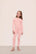 Model is wearing Kids TENCEL™ Modal Unisex Long PJ Set in Silver Pink/Ivory