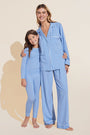 Model wears Kids Printed TENCEL™ Modal Unisex Long PJ Set in Nordic Stripes Vista Blue/Ivory.