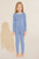 Model wears Kids TENCEL™ Modal Unisex Long PJ Set in Wedgewood Blue/Ivory.