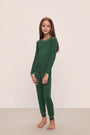 Model wears Kids TENCEL™ Modal Unisex Long PJ Set in Forest Green/Ivory.