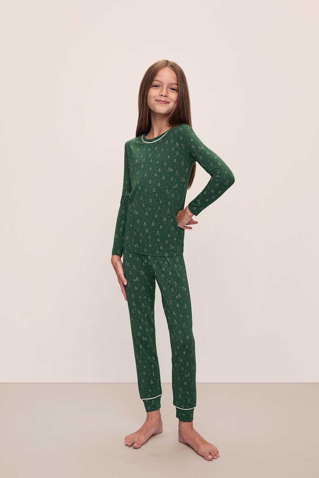 Model wears Kids Printed TENCEL™ Modal Unisex Long PJ Set in Winterpine Forest Green/Ivory.