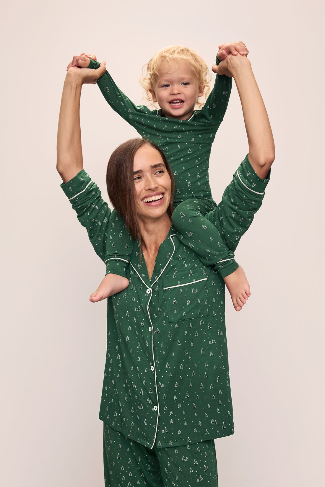 Model wears Kids Printed TENCEL™ Modal Unisex Long PJ Set in Winterpine Forest Green/Ivory.