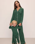 Model wears Kids Printed TENCEL™ Modal Unisex Long PJ Set in Winterpine Forest Green/Ivory.