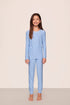 Model is wearing Kids Printed TENCEL™ Modal Unisex Long PJ Set in Nordic Stripe Vista Blue/White