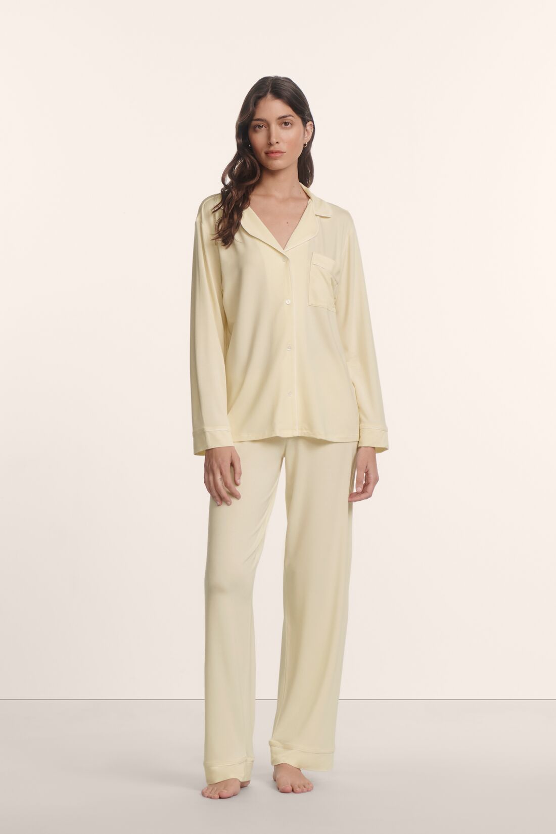 Model is wearing Gisele TENCEL™ Modal Long PJ Set in Buttercream/Ivory