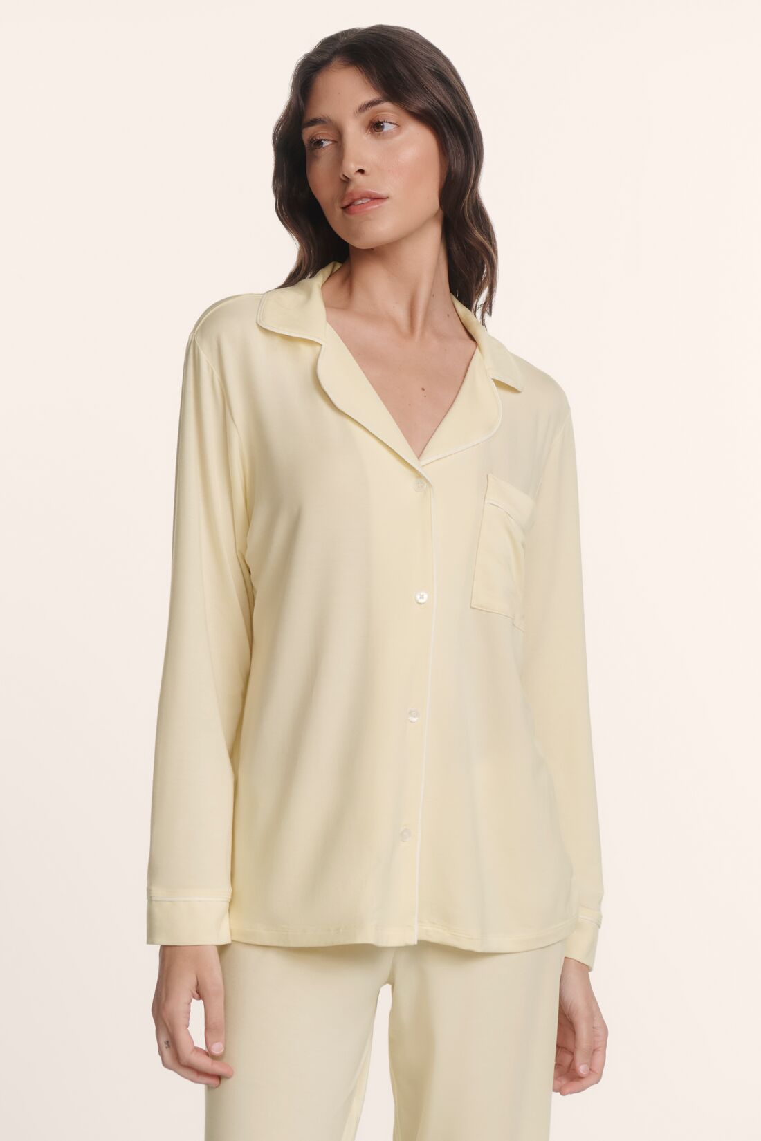 Model is wearing Gisele TENCEL™ Modal Long PJ Set in Buttercream/Ivory