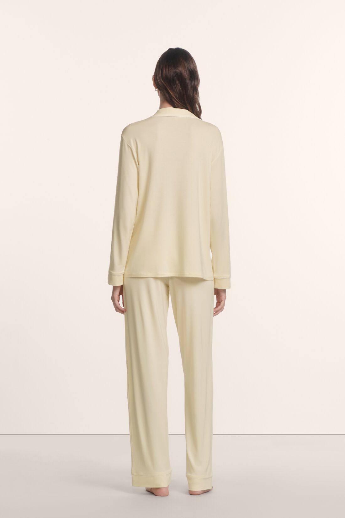 Model is wearing Gisele TENCEL™ Modal Long PJ Set in Buttercream/Ivory