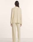 Model is wearing Gisele TENCEL™ Modal Long PJ Set in Buttercream/Ivory