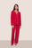 Model is wearing Gisele TENCEL™ Modal Long PJ Set  in Holly Red/Ivory