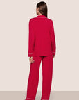 Model is wearing Gisele TENCEL™ Modal Long PJ Set  in Holly Red/Ivory