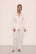 Model wears Gisele TENCEL™ Modal Long PJ Set in Pure Ivory/Navy