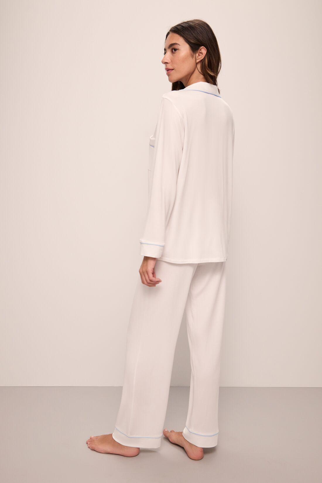 Model wears Gisele TENCEL™ Modal Long PJ Set in white/ice blue.