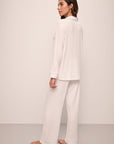 Model wears Gisele TENCEL™ Modal Long PJ Set in white/ice blue.