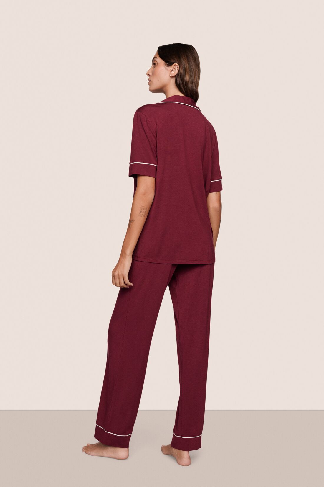 Model is wearing Gisele TENCEL™ Modal Short Sleeve & Pant PJ Set  in Bordeaux/Ivory