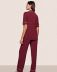Model is wearing Gisele TENCEL™ Modal Short Sleeve & Pant PJ Set  in Bordeaux/Ivory