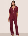 Model is wearing Gisele TENCEL™ Modal Short Sleeve & Pant PJ Set  in Bordeaux/Ivory