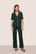 Model is wearing Gisele TENCEL™ Modal Short Sleeve & Pant PJ Set  in Pine/Ivory