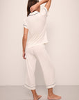 Model wears Gisele TENCEL™ Modal Short Sleeve Cropped PJ Set in pure ivory/navy.