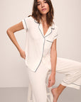 Model wears Gisele TENCEL™ Modal Short Sleeve Cropped PJ Set in pure ivory/navy.