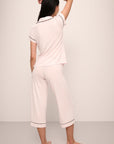 Model wears Gisele TENCEL™ Modal Short Sleeve Cropped PJ Set in sorbet pink/navy.