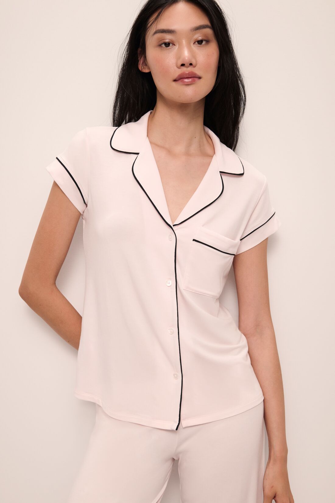 Model wears Gisele TENCEL™ Modal Short Sleeve Cropped PJ Set in sorbet pink/black.