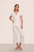 Model is wearing Gisele TENCEL™ Modal Short Sleeve Cropped PJ Set in White/Ice Blue