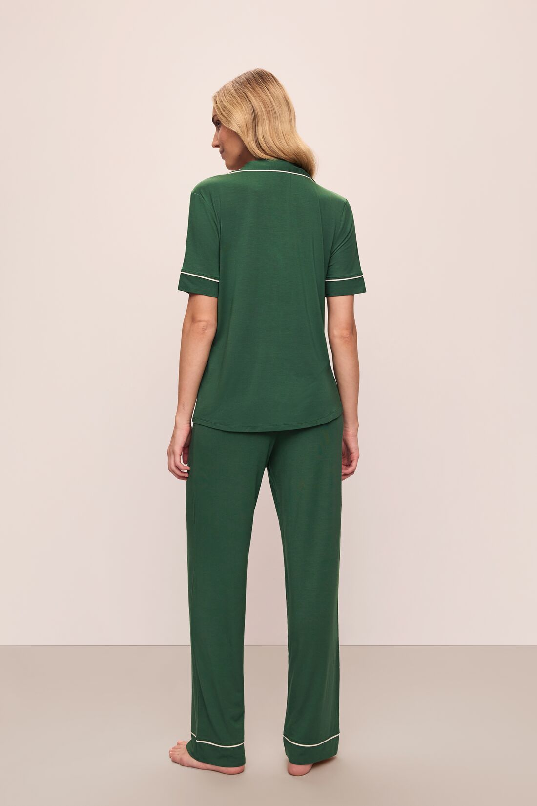 Model wears Gisele TENCEL™ Modal Short Sleeve & Pant PJ Set in Forest Green/Ivory.