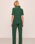 Model wears Gisele TENCEL™ Modal Short Sleeve & Pant PJ Set in Forest Green/Ivory.