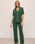 Model wears Gisele TENCEL™ Modal Short Sleeve & Pant PJ Set in Forest Green/Ivory.