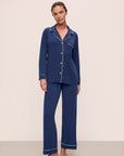 Model wears Gisele TENCEL™ Modal Long PJ Set in Navy/Ivory