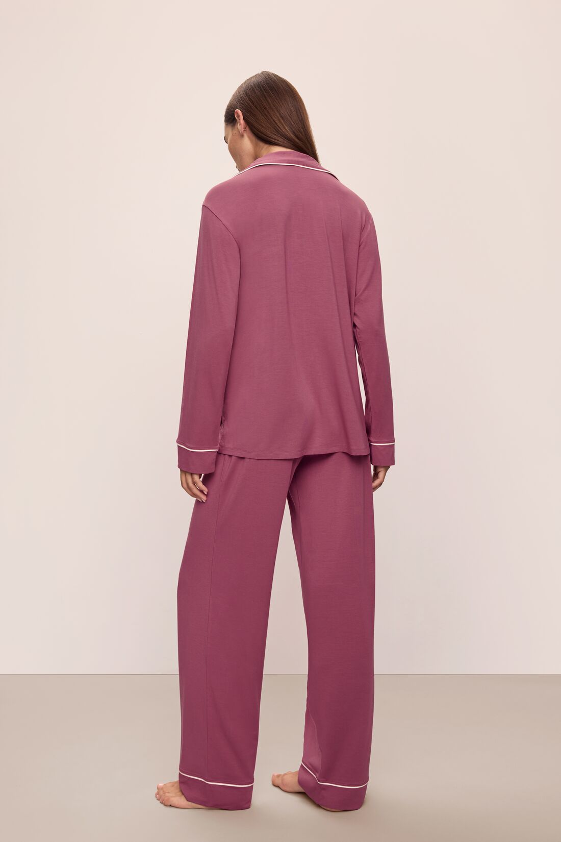 Model wears Gisele TENCEL™ Modal Long PJ Set in Raspberry/Ivory.