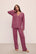 Model wears Gisele TENCEL™ Modal Long PJ Set in Raspberry/Ivory.