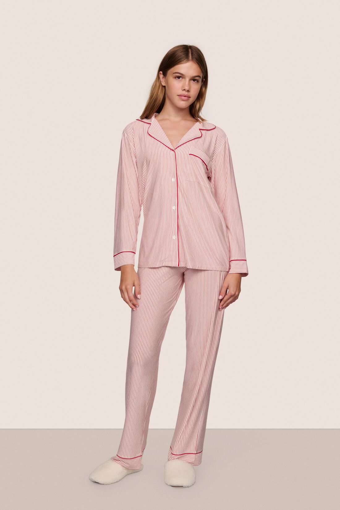 Model is wearing Gisele TENCEL™ Printed Modal Long PJ Set in Duo Stripe Holly Red/Holly Red