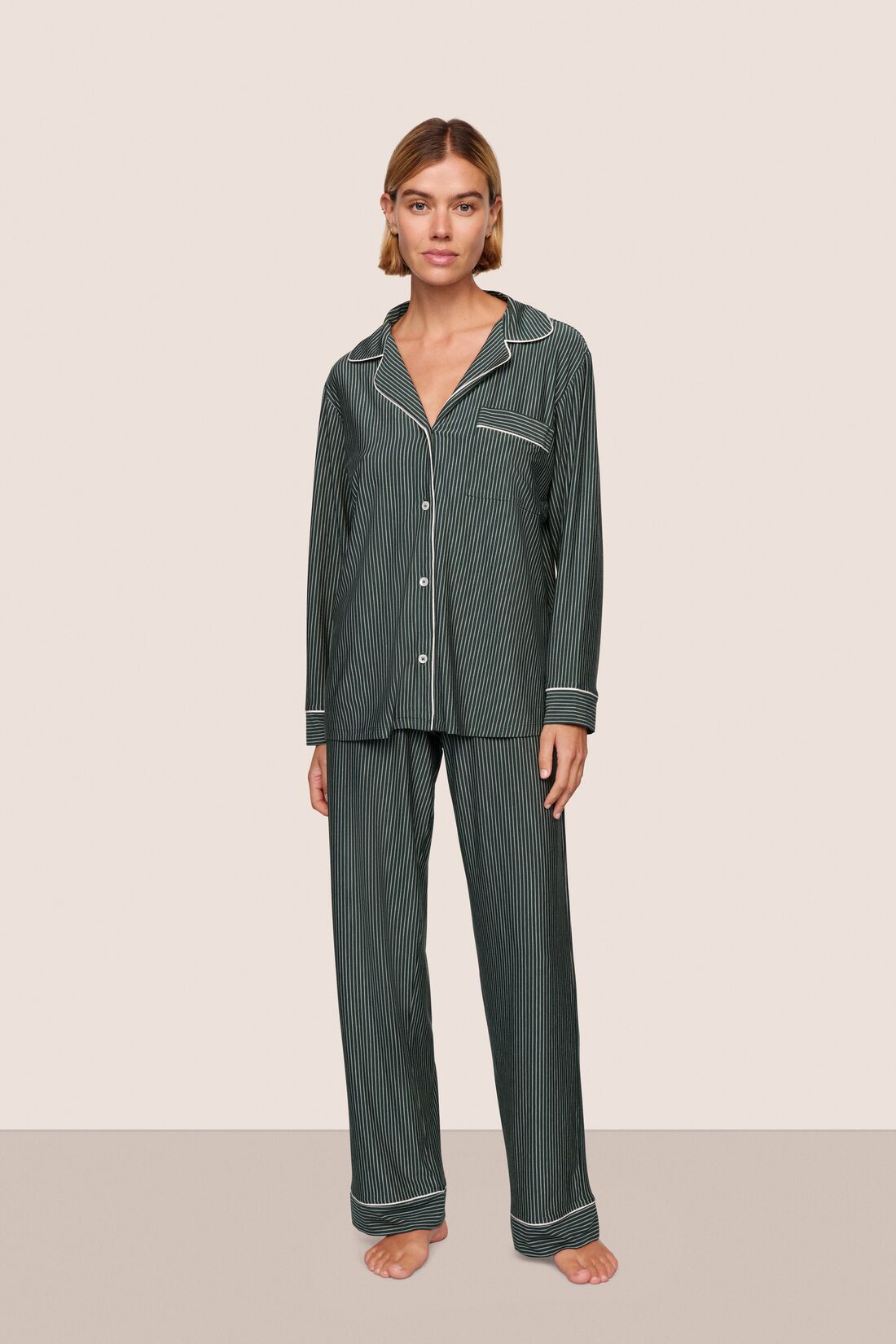 Model is wearing Gisele Printed TENCEL™ Modal Long PJ Set  in Duo Stripe Pine/Ivory