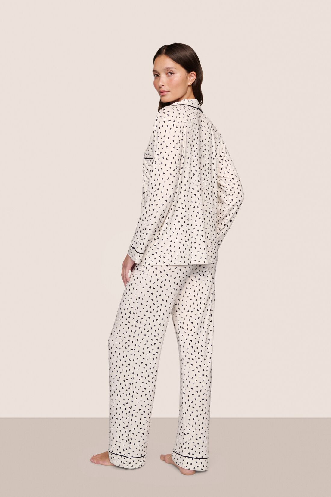 Model is wearing Gisele Printed TENCEL™ Modal Long PJ Set  in Heart To Heart Black/Blk