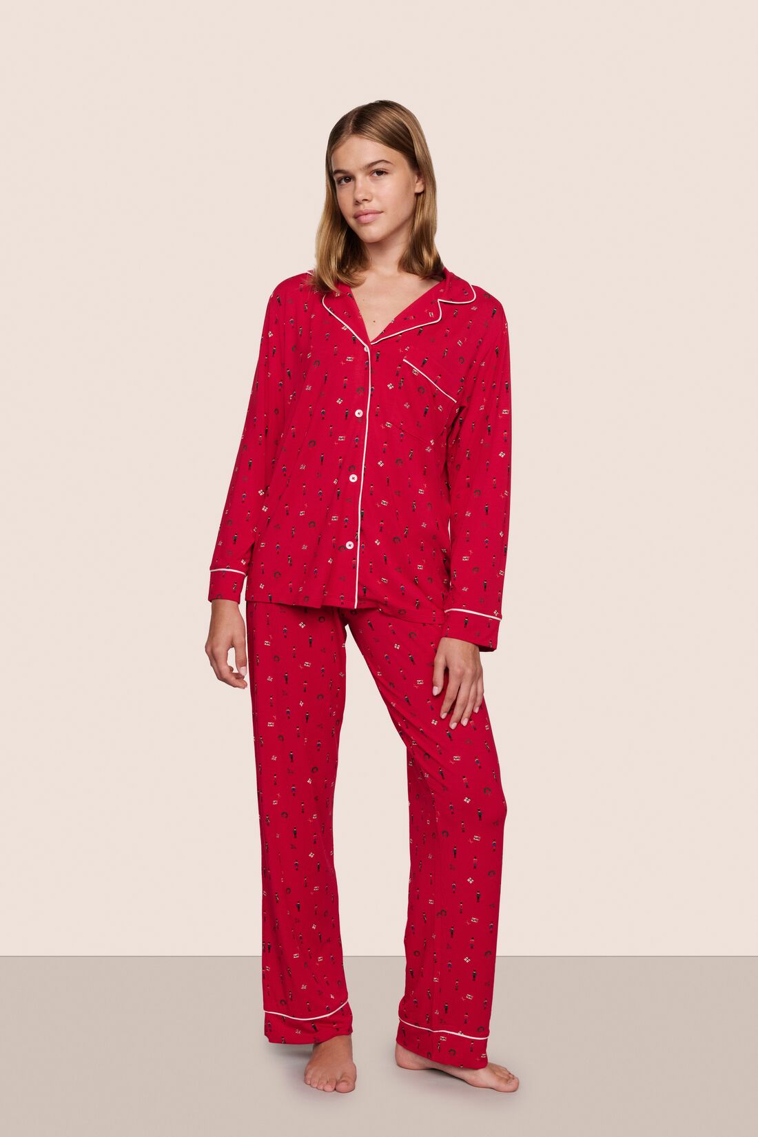 Model is wearing Gisele TENCEL™ Printed Modal Long PJ Set in Nutcracker Holly Red/Ivory