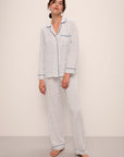 Model wears Gisele Printed TENCEL™ Modal Long PJ Set in Petite Batik Ivory/Denim Blue.