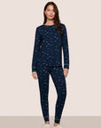Model is wearing Gisele Printed TENCEL™ Modal Crewneck PJ Set  in Forest Pine Navy/Ivory