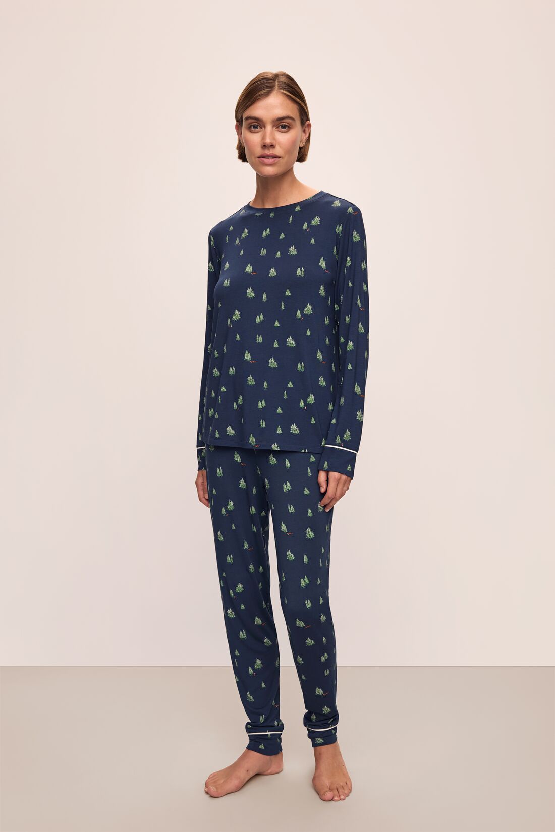 Model wears the Gisele Printed TENCEL™ Modal Crewneck PJ Set in Woodland Pine Navy/Ivory.